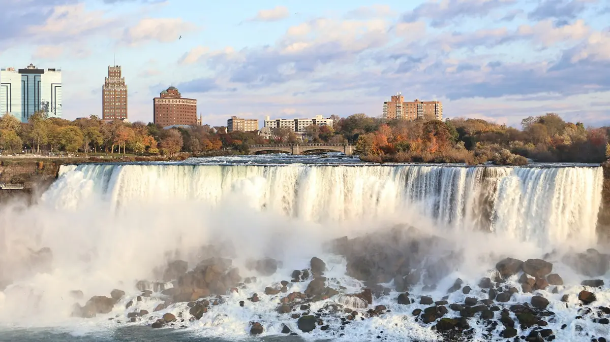 American Falls with buildings and autumn trees behind