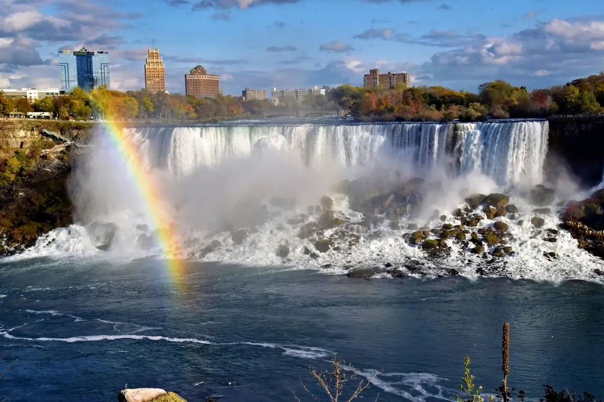 Rainbow over the American Falls with the Niagara Falls skyline